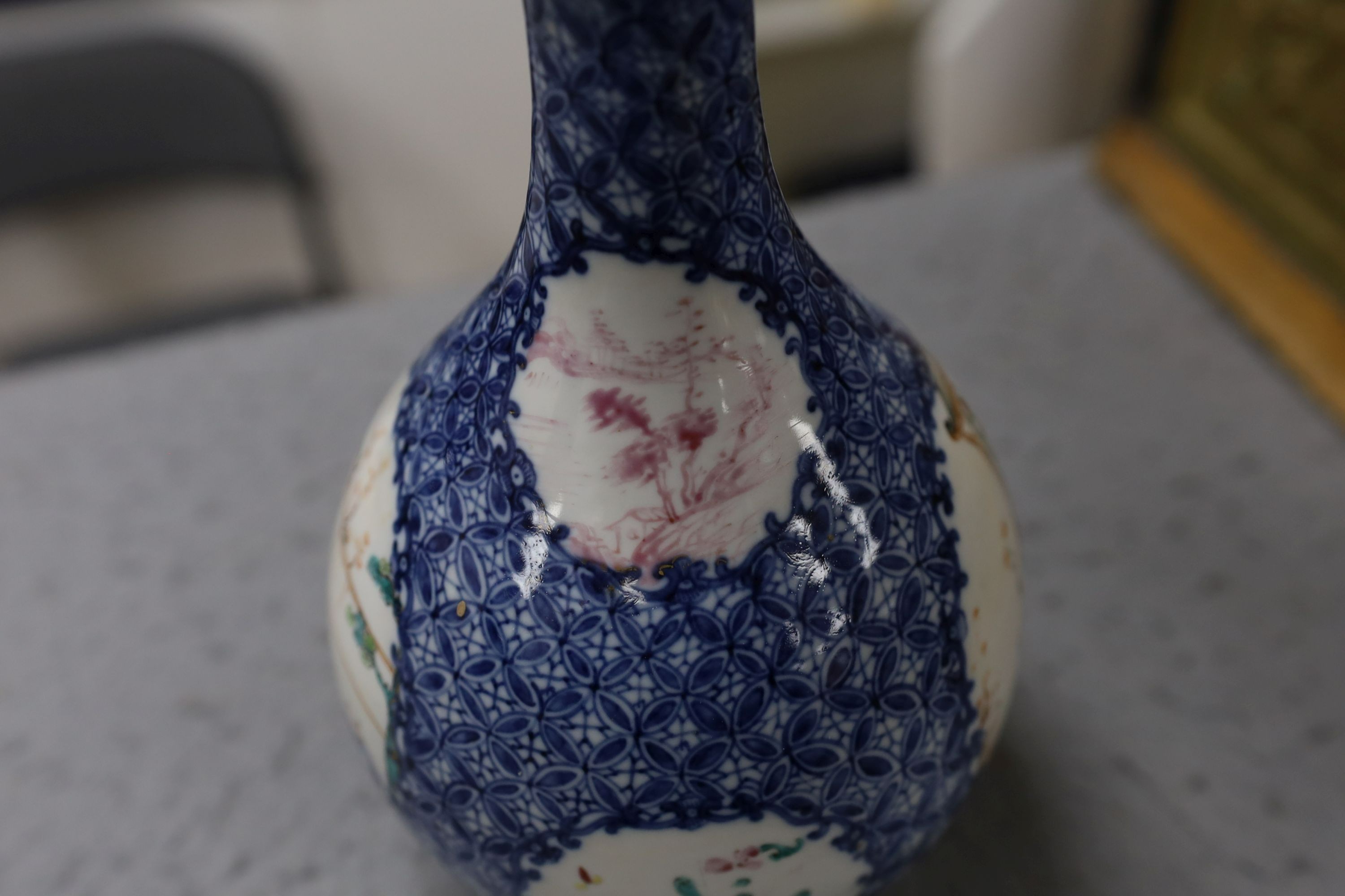 A pair Samson of Paris vases in the Chinese famille verte style and a Chinese Qianlong famille rose garlic neck vase with blue panelling motif, tallest 26cm